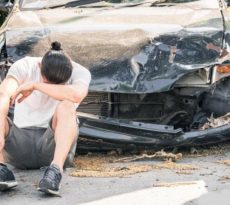 a person with a damaged car